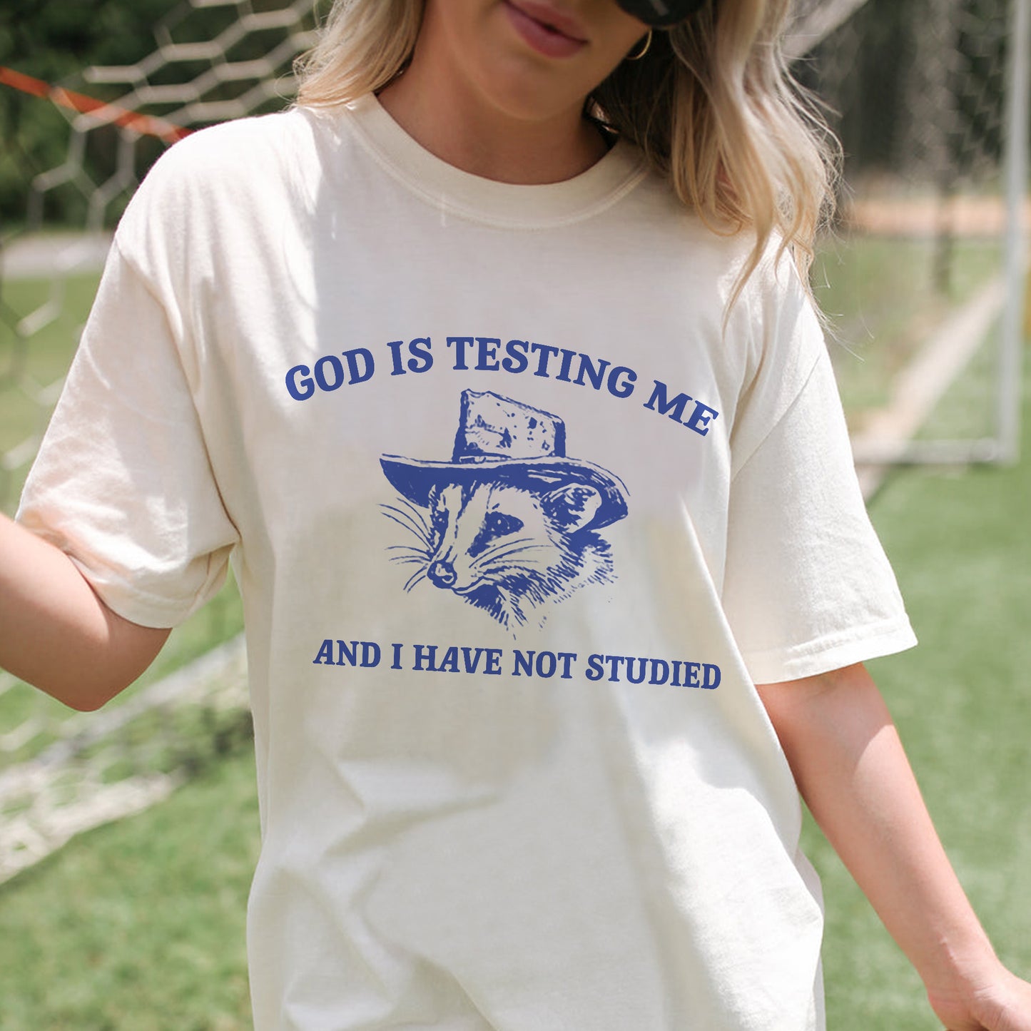 Funny Faith Shirt – God Is Testing Me and I Have Not Studied – Raccoon Meme Christian Tee – Natural – Up To 5XL