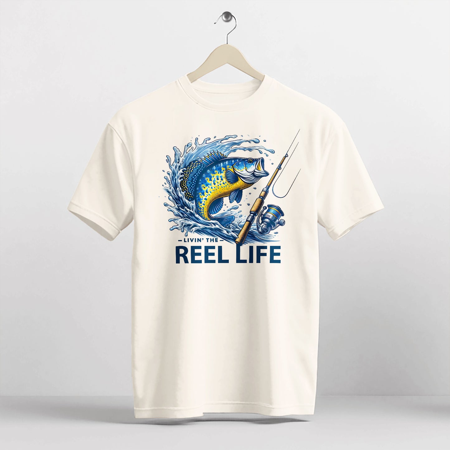 Funny Fisherman Shirt – Livin' The Reel Life Fishing Pun Tee – Humor Gift for Anglers – Natural – Up To 5XL