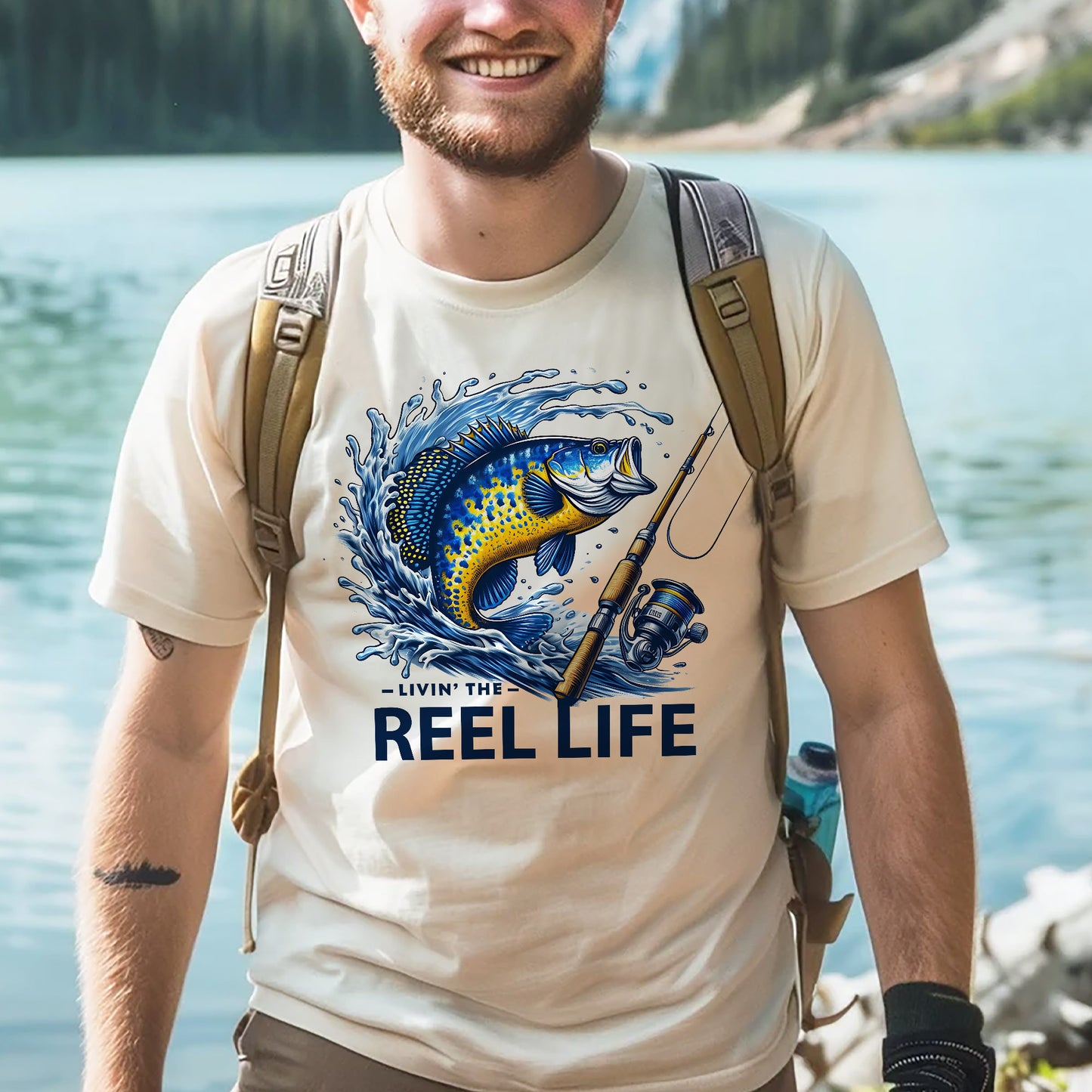 Funny Fisherman Shirt – Livin' The Reel Life Fishing Pun Tee – Humor Gift for Anglers – Natural – Up To 5XL