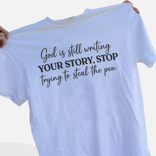 God Is Still Writing Your Story – Stop Trying To Steal The Pen T-Shirt   -  Funny Jesus Shirt For Christians- White- Up To 5XL