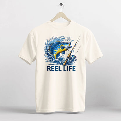 Funny Fisherman Shirt – Livin' The Reel Life Fishing Pun Tee – Humor Gift for Anglers – Natural – Up To 5XL